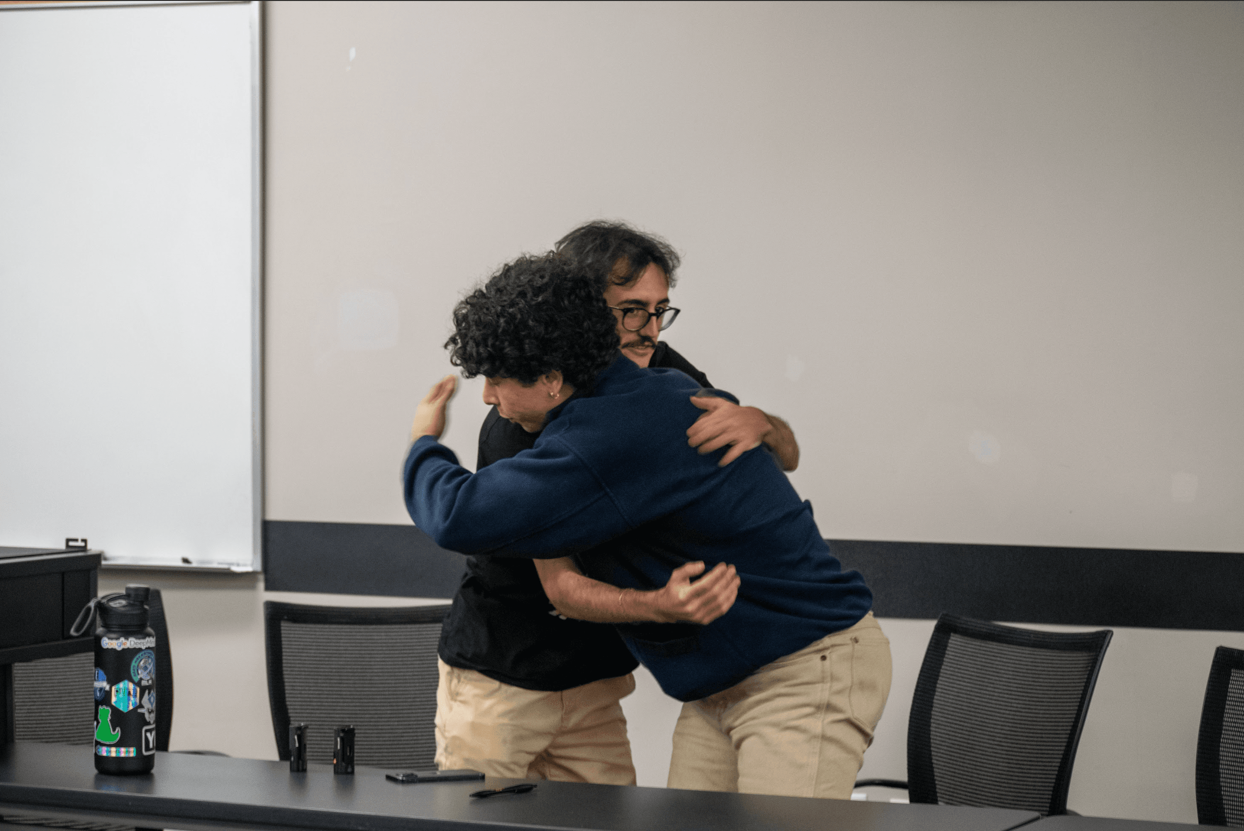 A candid moment between Bryan and a teammate